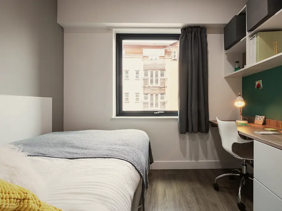 Premium Studio at AXO Kingston: Bed and study by the window