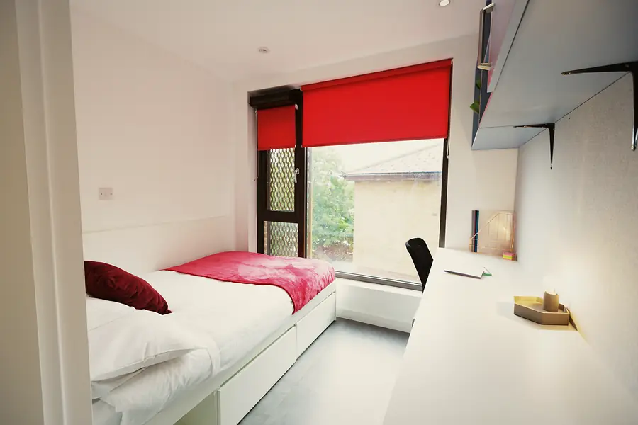 Silver Ensuite at AXO New Cross: Bed and study by the window