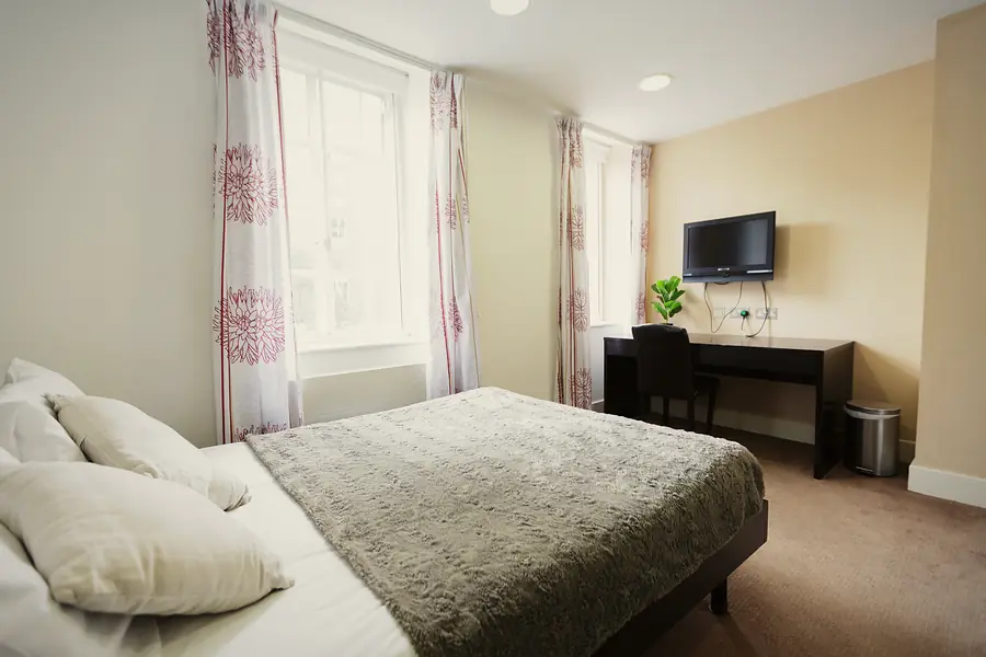 Gold Studio at AXO Oxford Circus: Bed by the window
